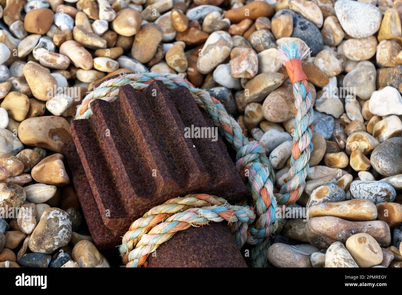 Nylon rope and old winch gear laying on the beach at Dungeness Stock