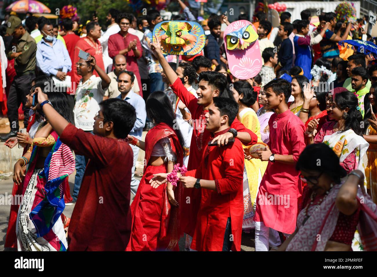 Bangladeshi youth seen dancing and participating in a colorful rally to