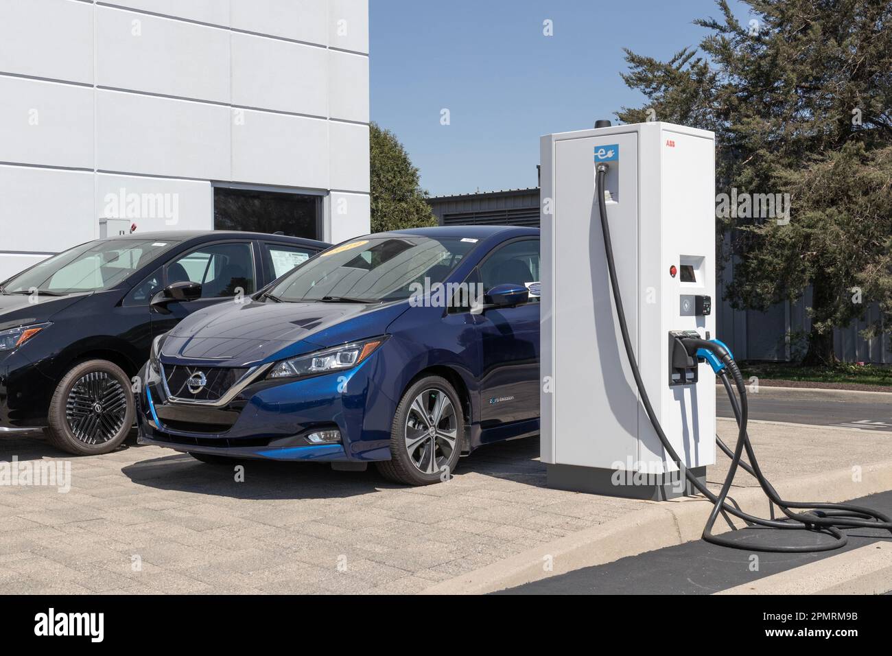Indianapolis - Circa April 2023: ABB EV Electric Vehicle Charger with multiple connections at a Nissan dealership. ABB offers EV charging solutions. Stock Photo