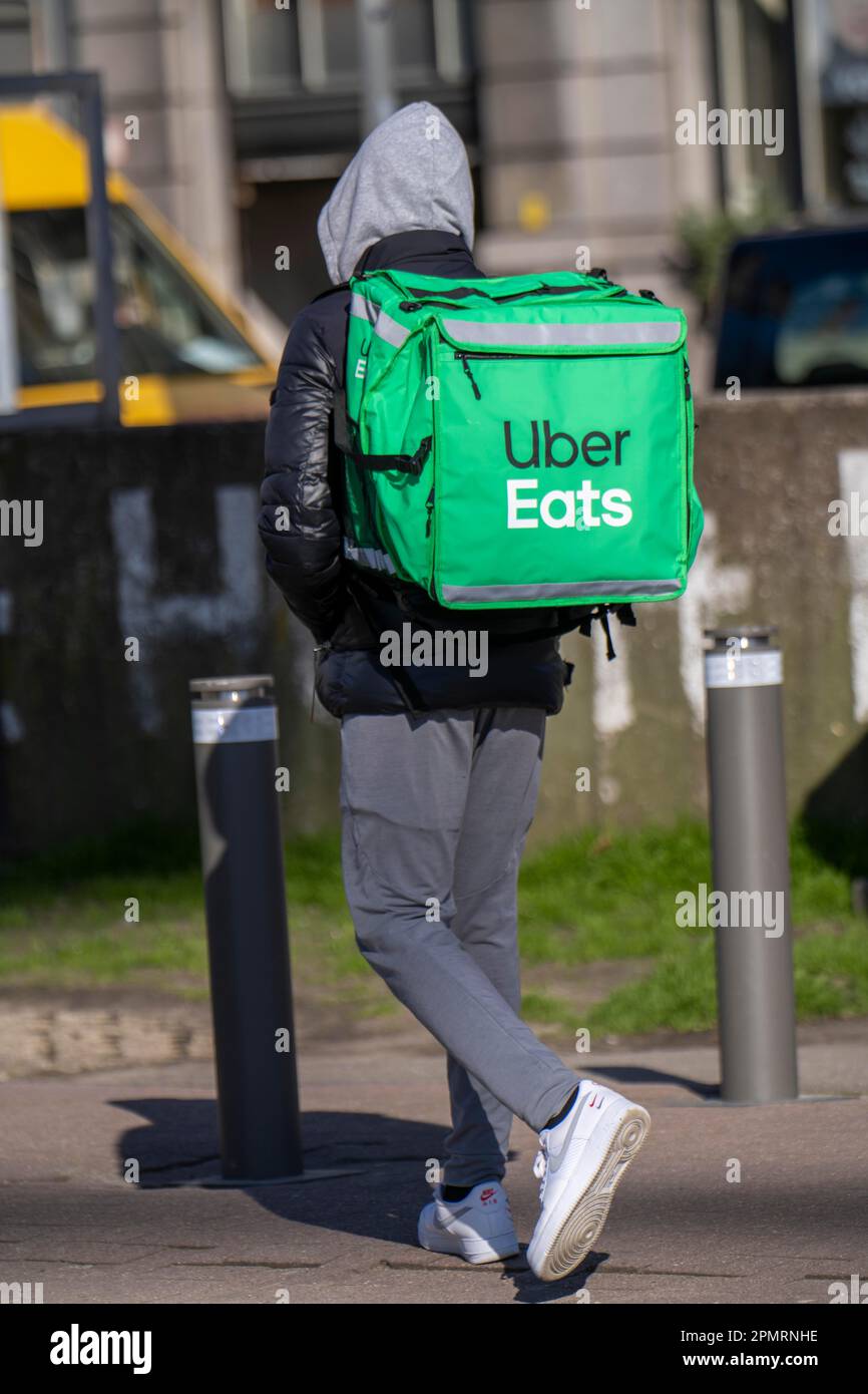 Food, food delivery service Uber Eats, delivery boy, walking in Antwerp, Flanders, Belgium, Stock Photo