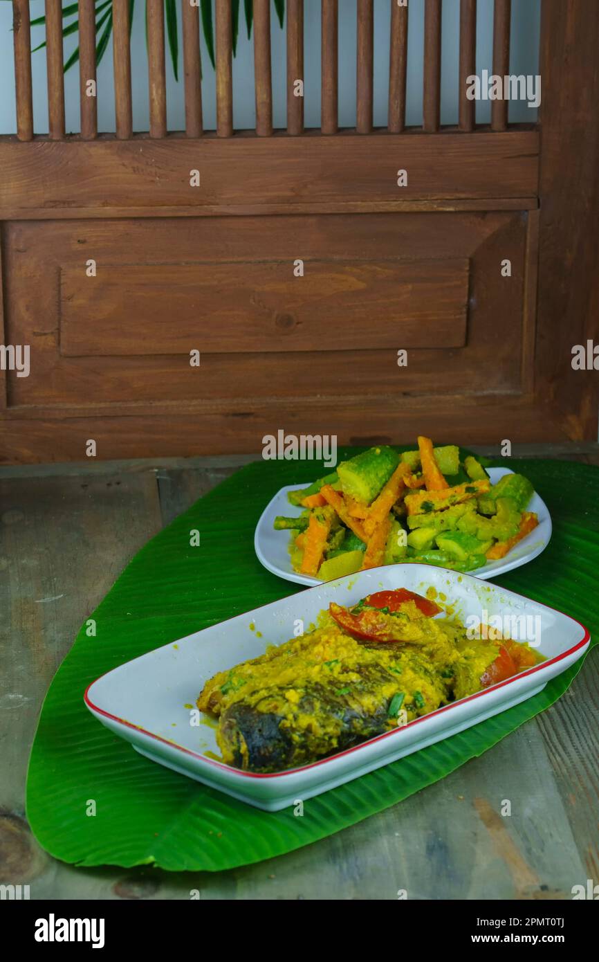 Pesmol ikan or Acar ikan kuning is a fish dish of gourami, mackerel