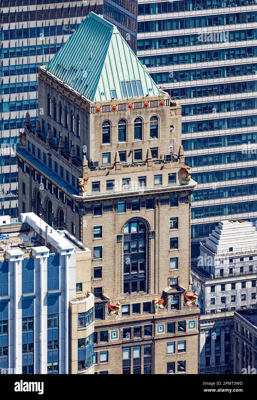 View from above: Colorful terra cotta decoration marks the top of the brick office tower Mercantile Building, 10 East 40th Street. Stock Photo