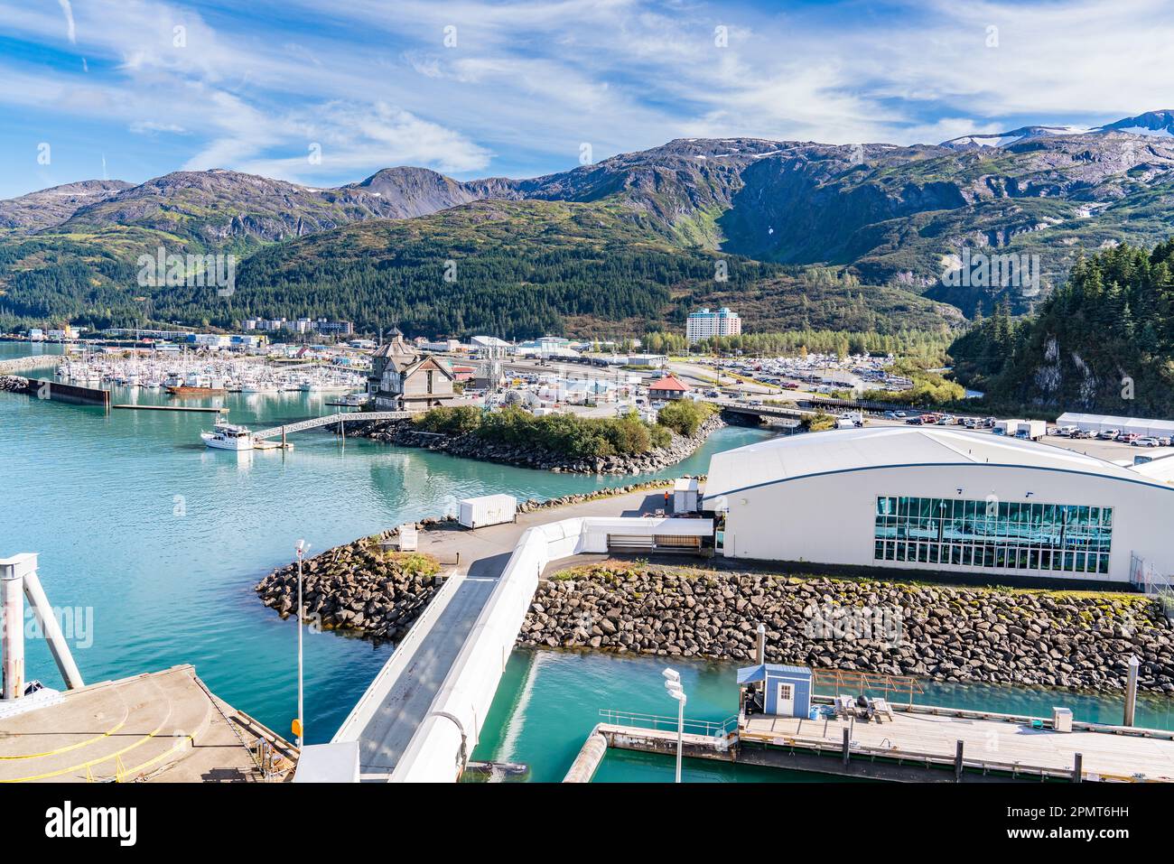 Whittier, AK - September 4, 2022 - Skyline of the port of Whittier, Alaska with the cruise ship terminal in the foreground. Stock Photo