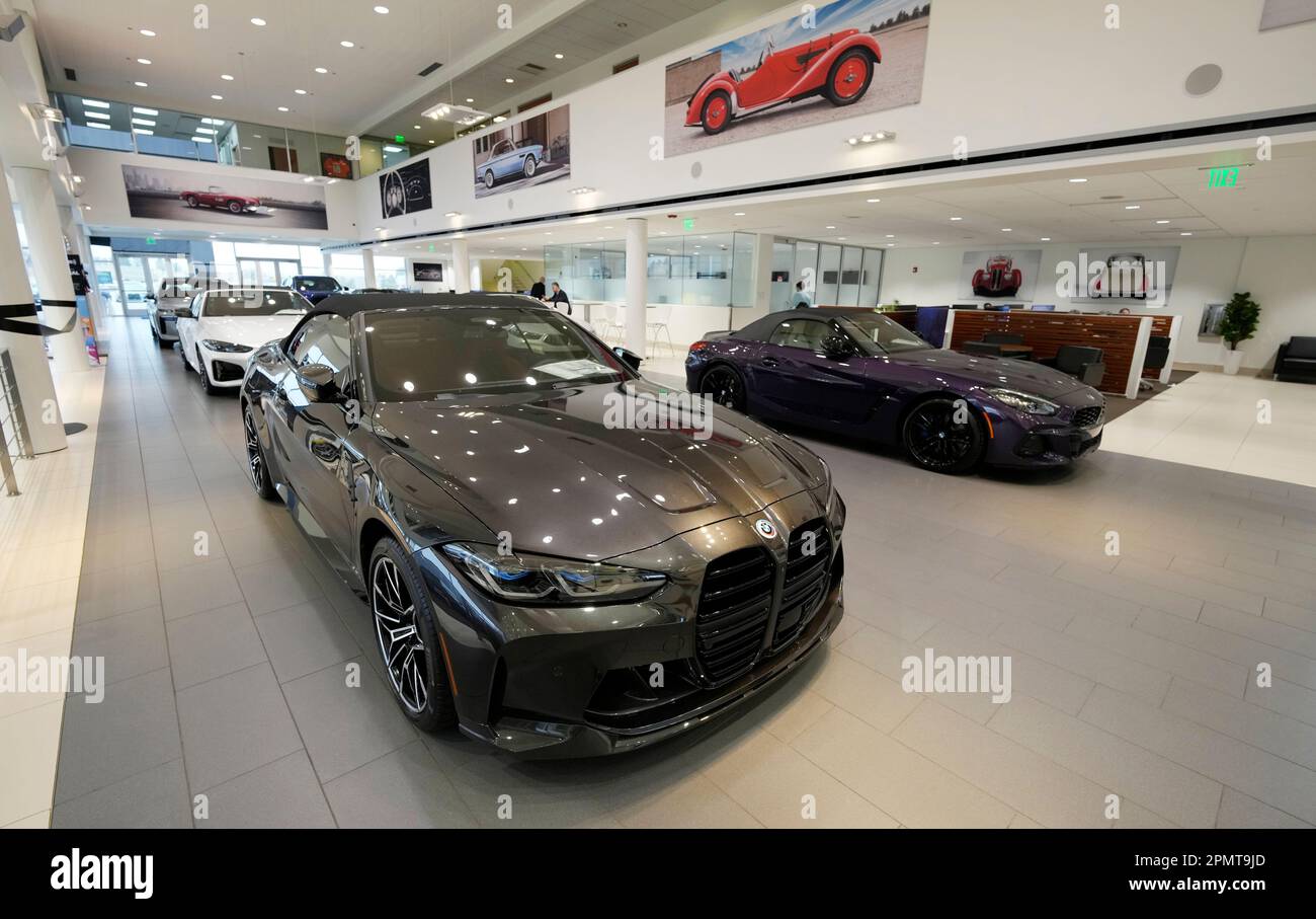 Unsold 2023 and 2024 models sit on the showroom floor of a BMW ...