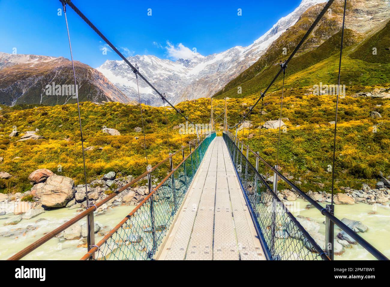 Crossing Tasman river on suspension cable walking bridge on Hooker