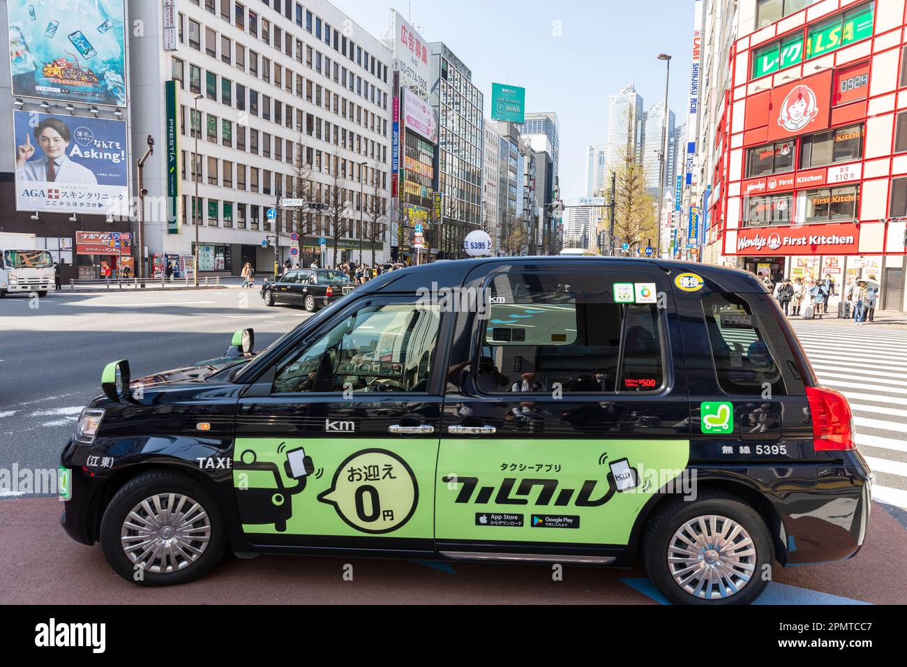 Shinjuku Tokyo April 2023, Toyota JPN black hybrid electric taxi cab ...