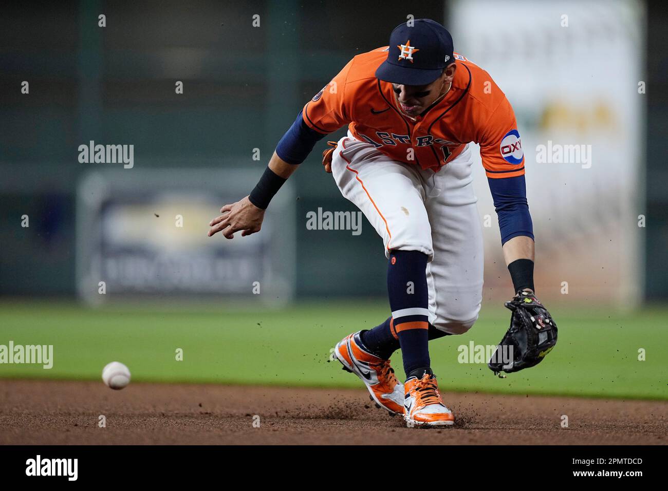 Houston Astros second baseman Mauricio Dubon fields a ground ball