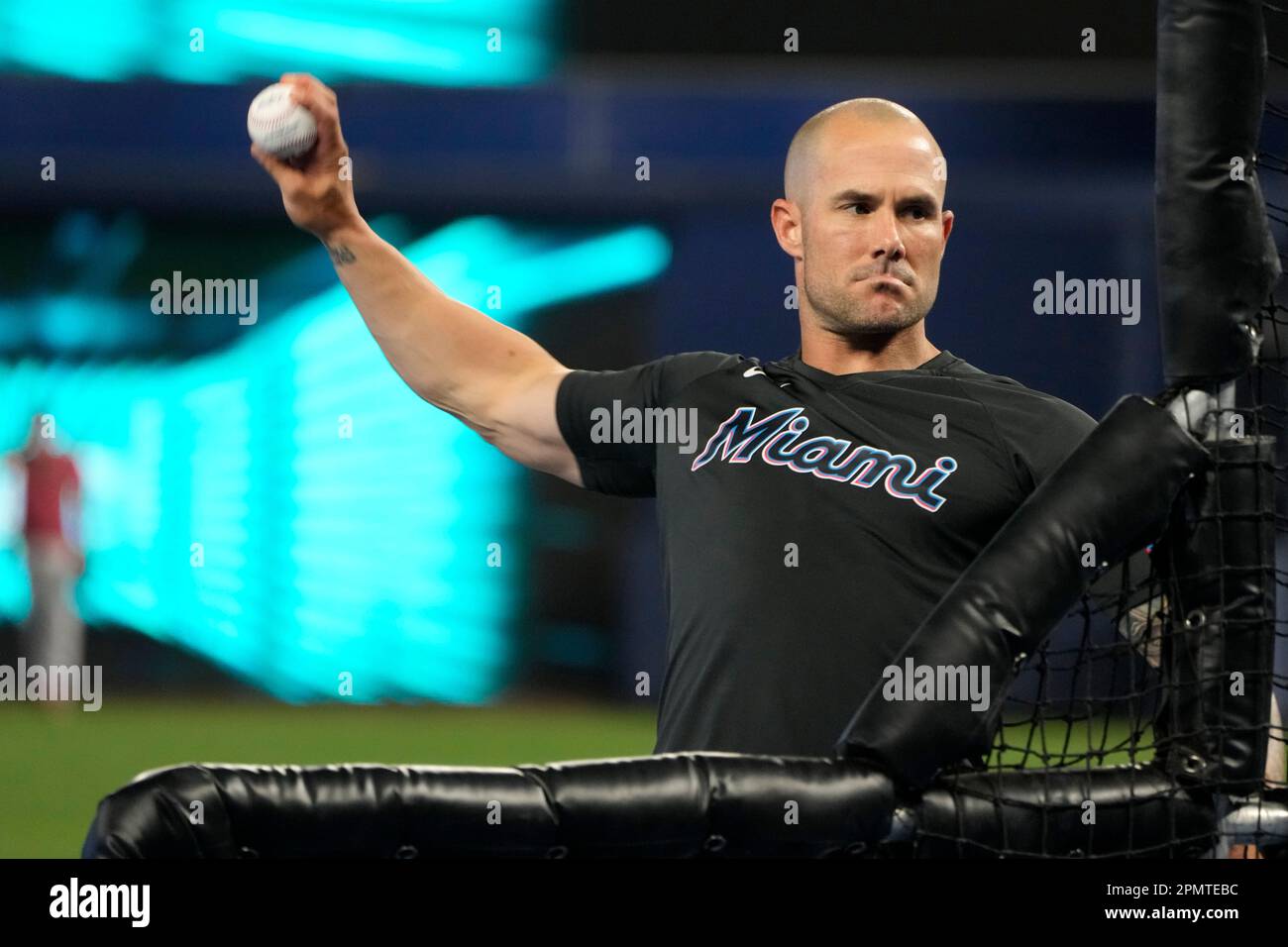 Miami Marlins manager Skip Schumaker throws batting practice before a