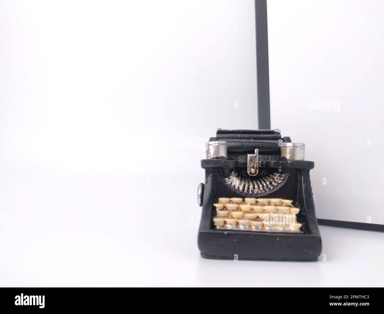 Black vintage typewritter on a white background. Stock Photo
