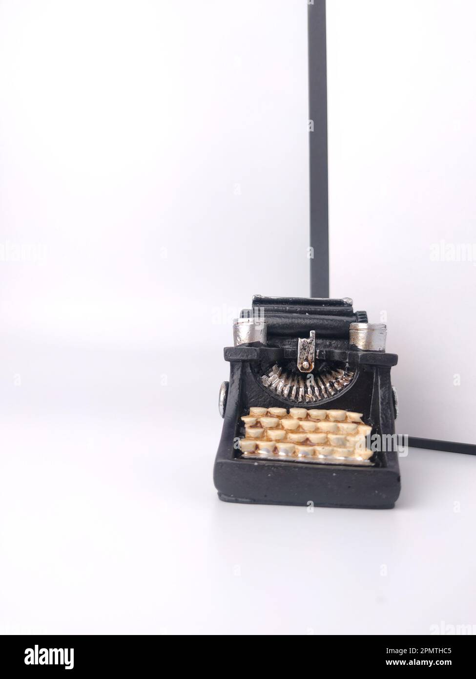 Black vintage typewritter on a white background. Stock Photo