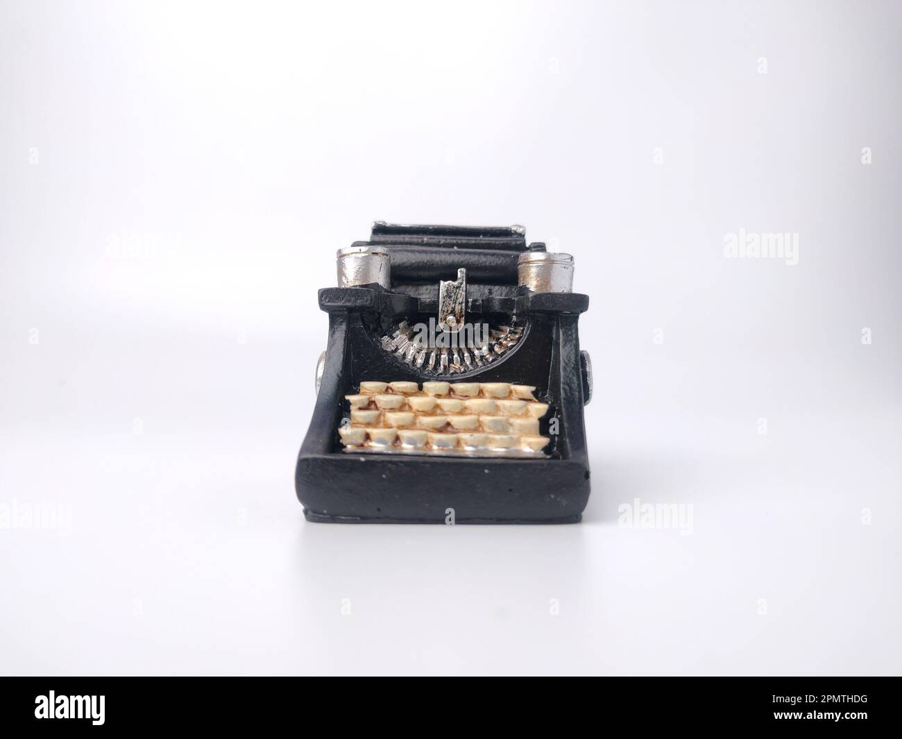 Black vintage typewritter on a white background. Stock Photo