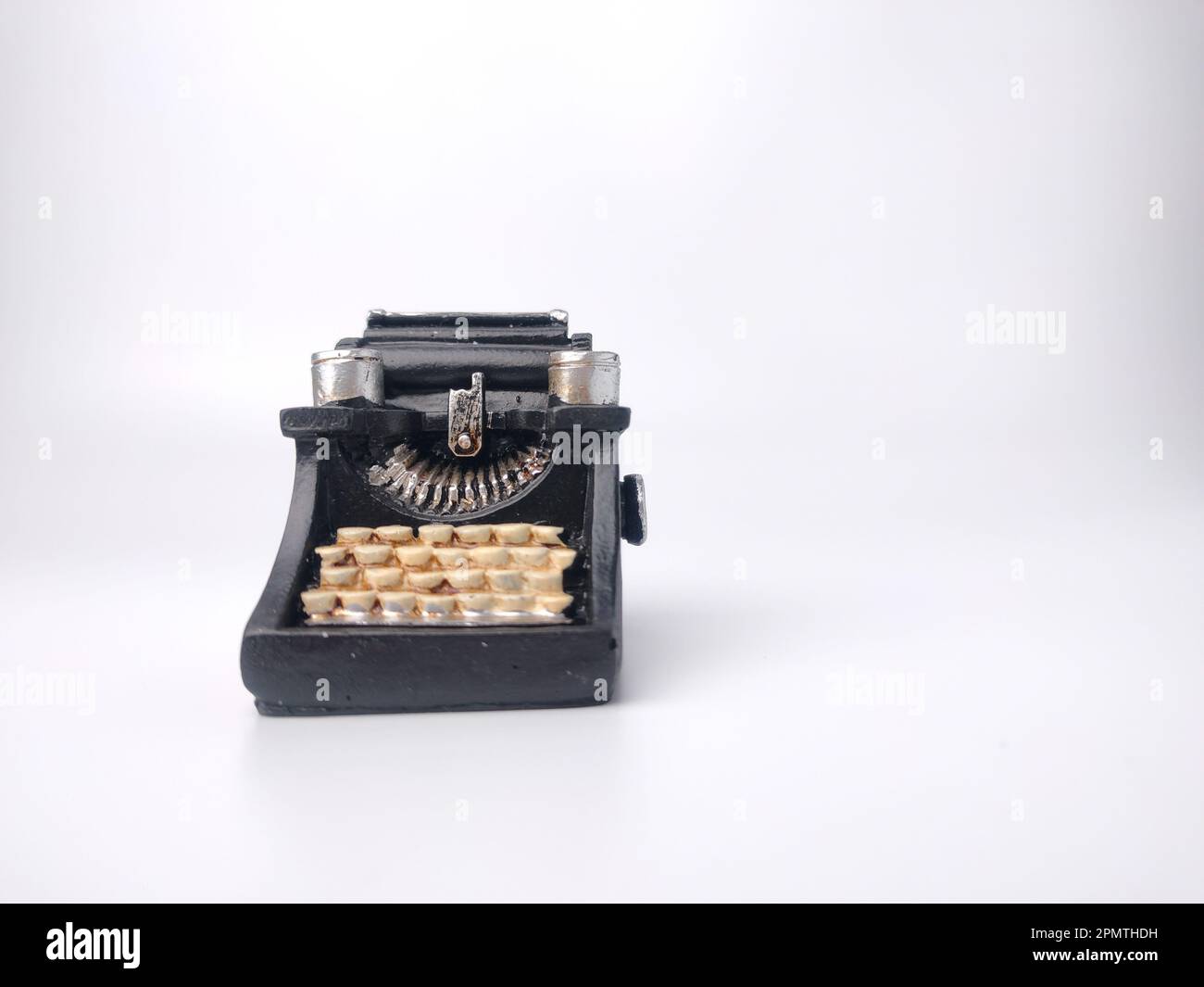 Black vintage typewritter on a white background. Stock Photo