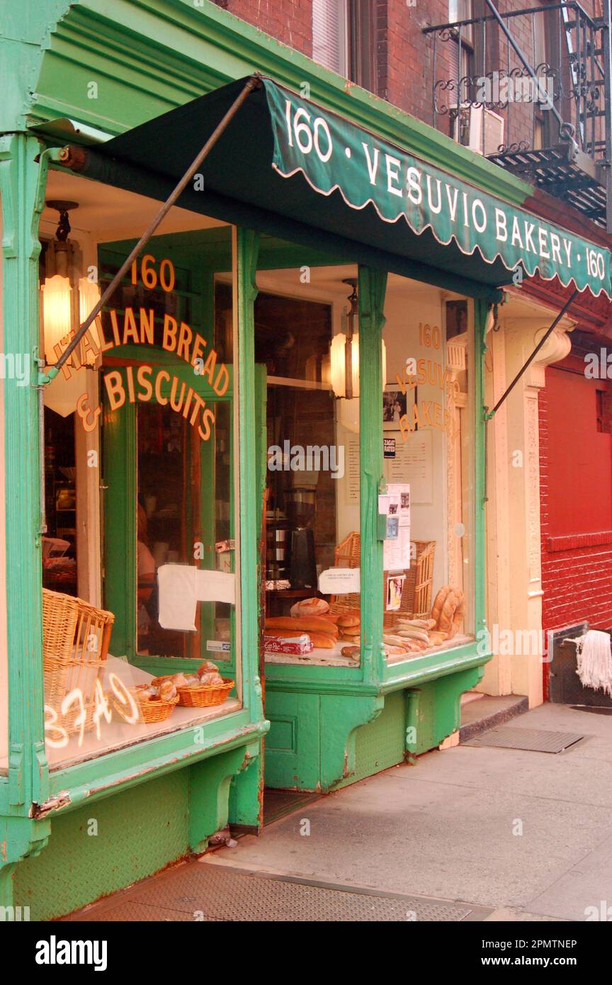 Bread loafs are placed in the window of an old time Italian bakery