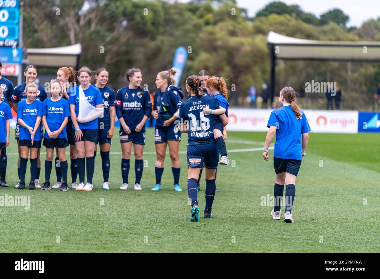 15 April,2023. Casey Fields, Victoria, Australia. The players from Melbourne Victory and Melbourne City make their way on the to pitch prior to the start of the game. Credit: James Forrester/Alamy Live News Stock Photo