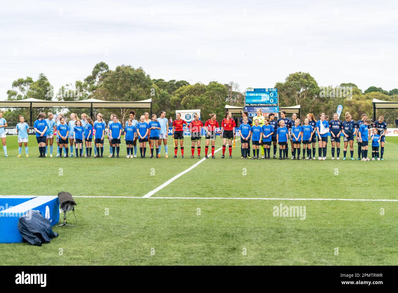 15 April,2023. Casey Fields, Victoria, Australia. The players from Melbourne Victory and Melbourne City make their way on the to pitch prior to the start of the game. Credit: James Forrester/Alamy Live News Stock Photo