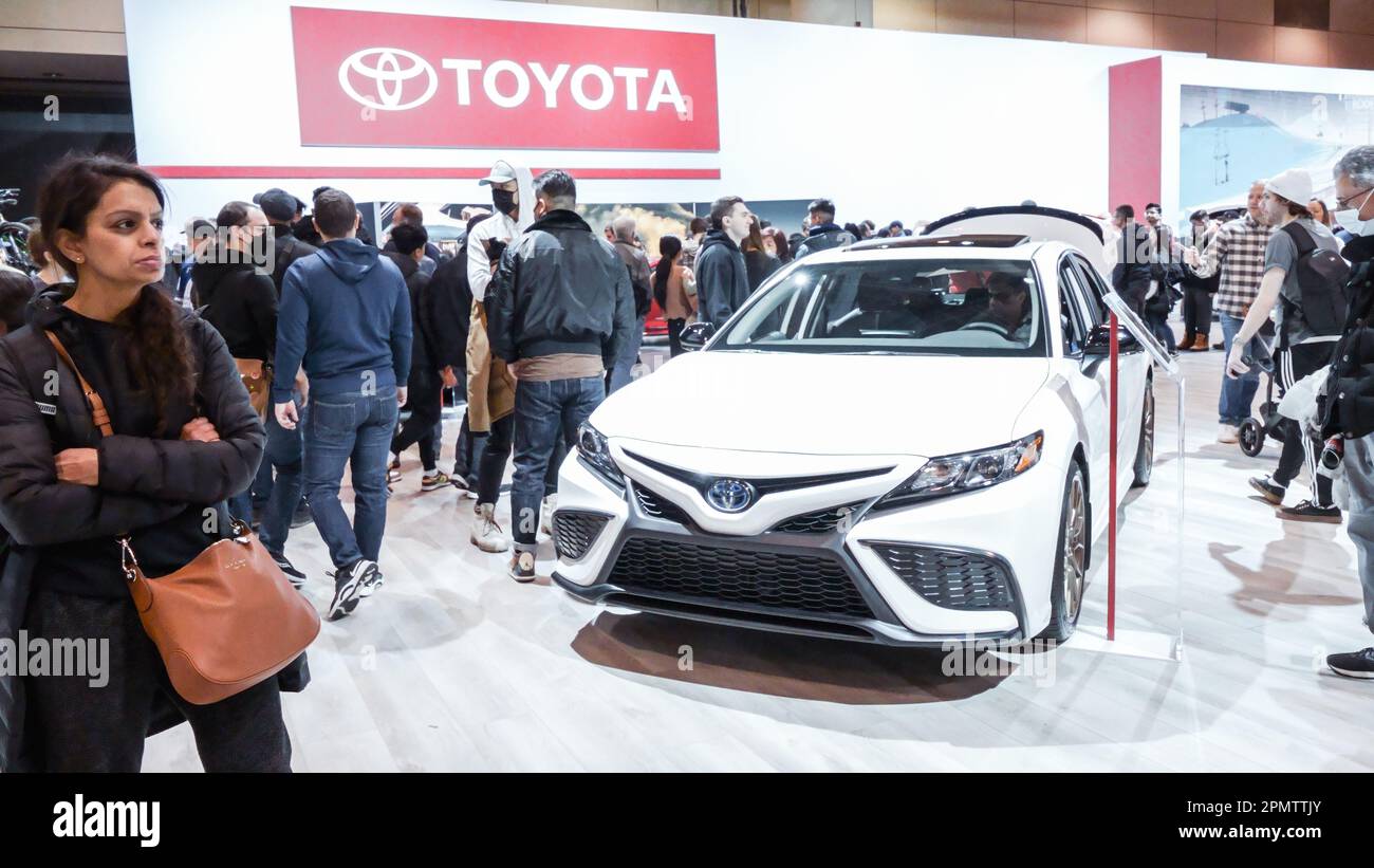Crowds looking at new car models at Auto show. Toyota car on display. National Canadian Auto Show with many car brands. Toronto ON Canada Feb 19, 2023 Stock Photo