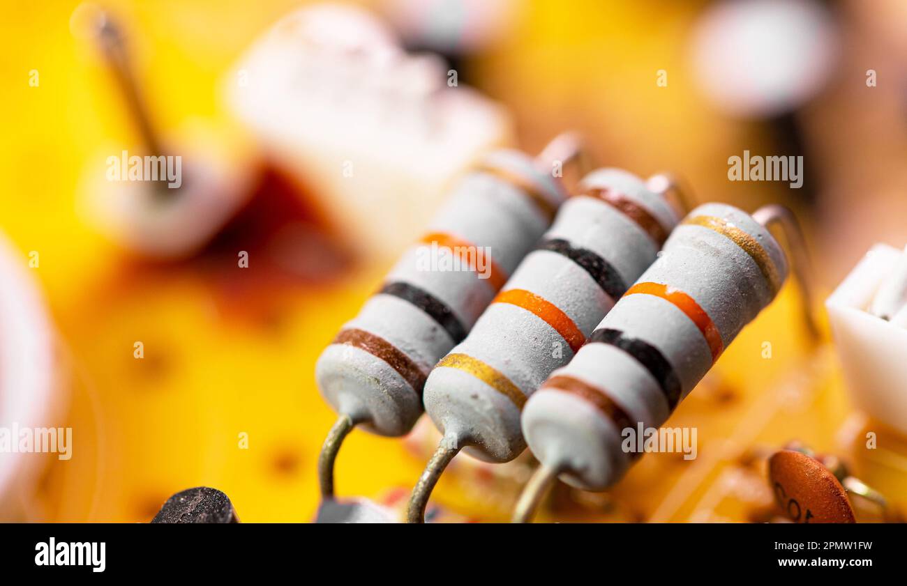 A close-up view of a circuit board with various electronic components, mounted on an electronic device Stock Photo