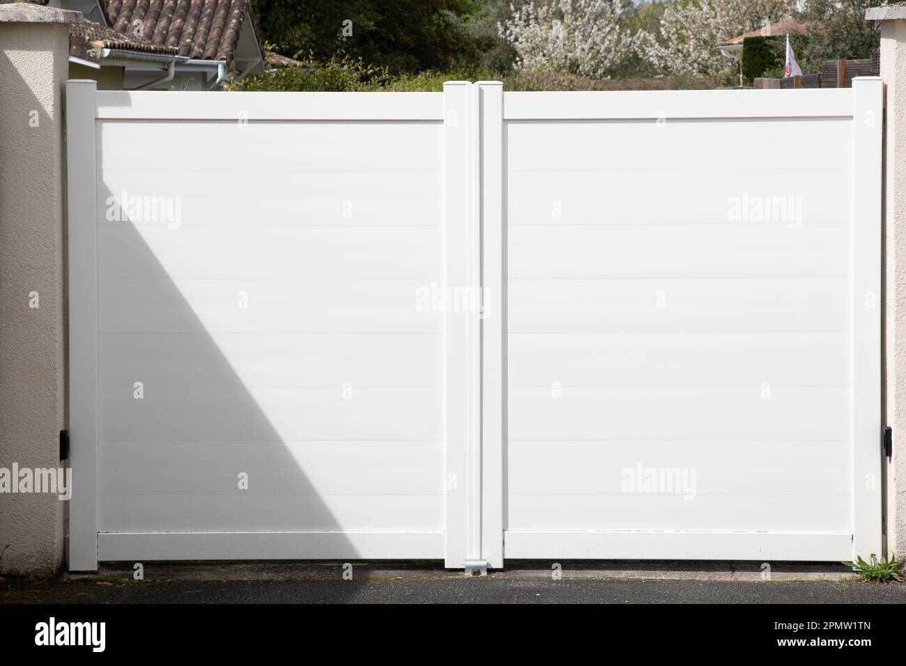 high modern white gate aluminum portal design of suburban house Stock Photo