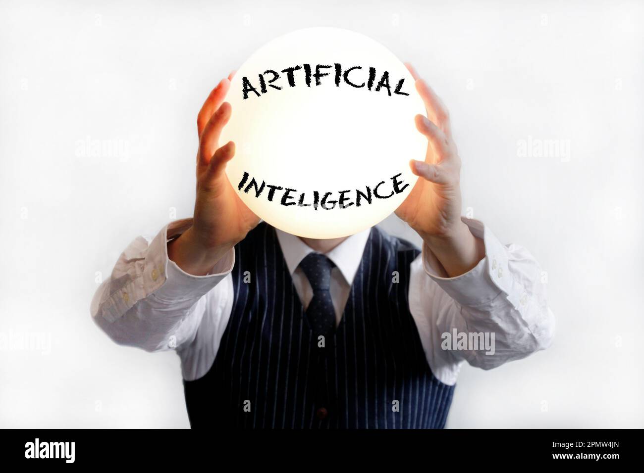 Businessman with a big shiny lamp instead of a head, with the word Artificial Intelligence written on it Stock Photo