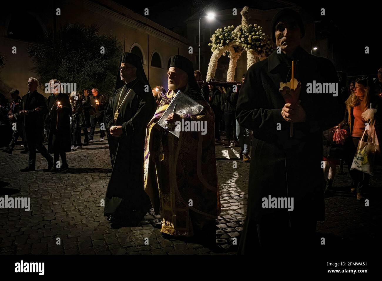 Rome, Italy. 14th Apr, 2023. The representation of the Edicule of the Holy Sepulchre is carried during the procession on the evening of Good Friday preceding the Orthodox Easter. Orthodox Christians from the Church of San Teodoro al Palatino accompany the representation of the Edicule of the Holy Sepulchre in procession with the Band of Carabinieri. The Greek-Orthodox church of San Teodoro al Palatino was built in the 6th century on the ruins of the Horrea Agrippiana, probably reusing a pre-existing circular temple. Tradition had it that the temple was dedicated to Romulus, and that the Capito Stock Photo