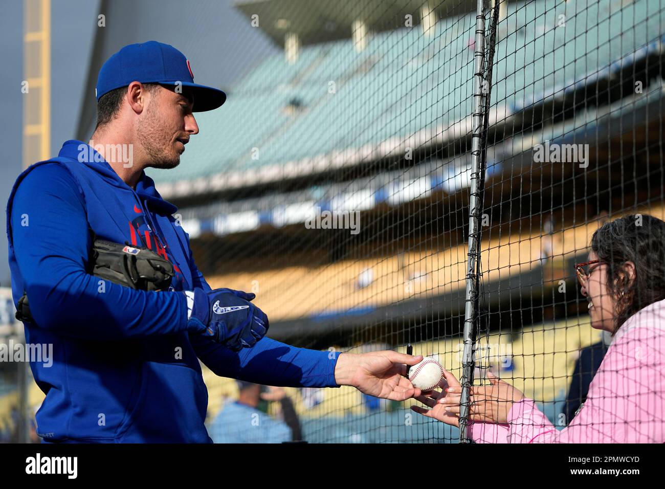 Chicago Cubs center fielder Cody Bellinger signs autographs prior to a