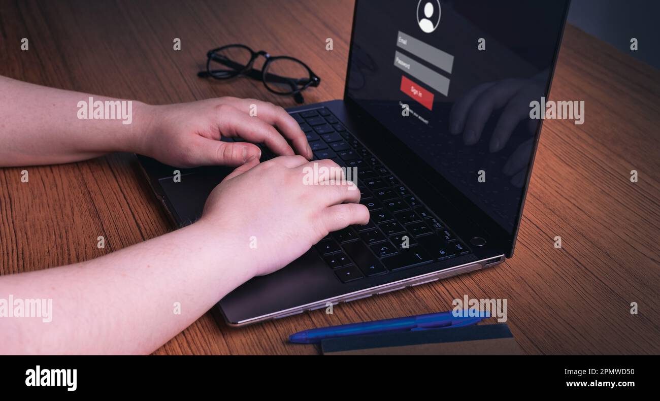 Woman using laptop to log in her personal user. Security information and encryption. Cybersecurity concept. Secure internet access. Stock Photo
