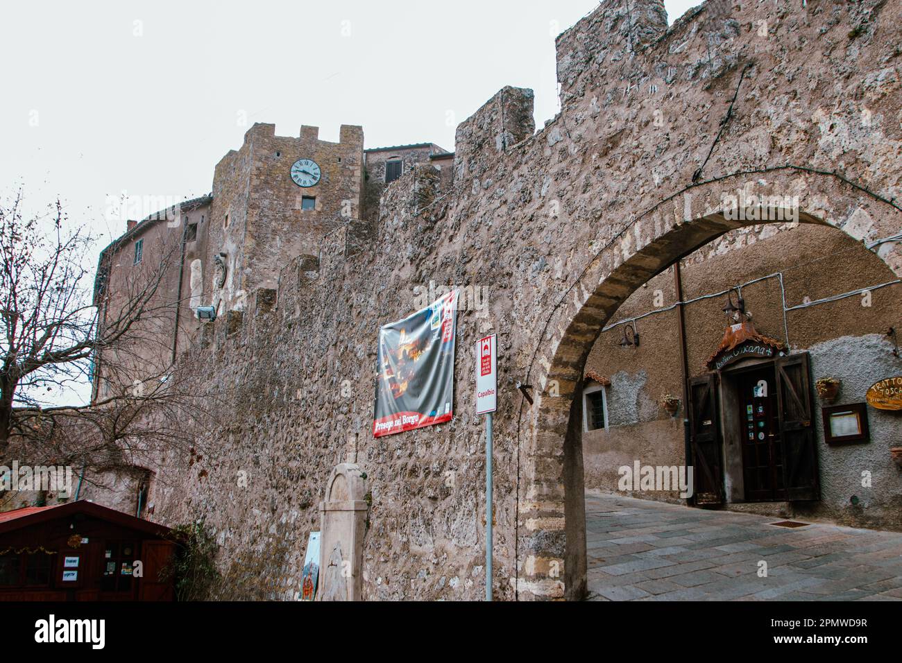 At Capalbio, Italy, On december 2019, medieval walls and  gate to the town, Tuscany, Italy, Stock Photo