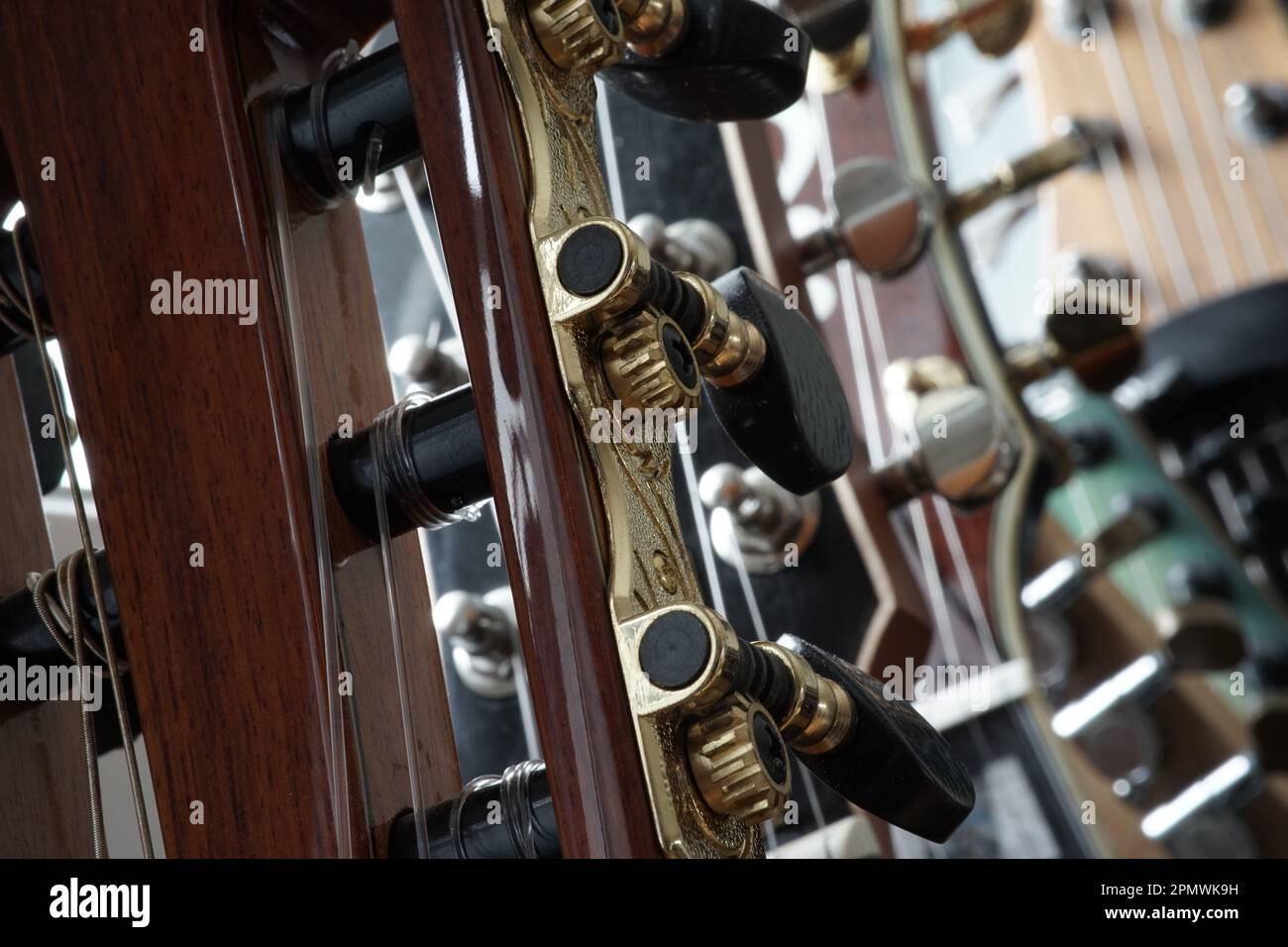 Heads of different types of guitars with beautiful wood and metal work