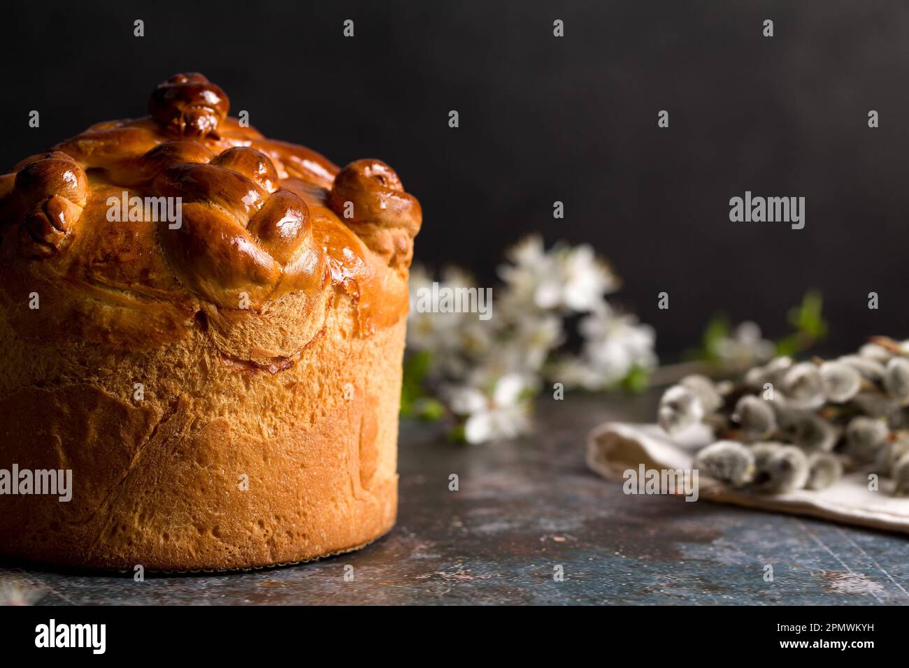 Homemade Easter cake with willow branches on a black background Stock Photo