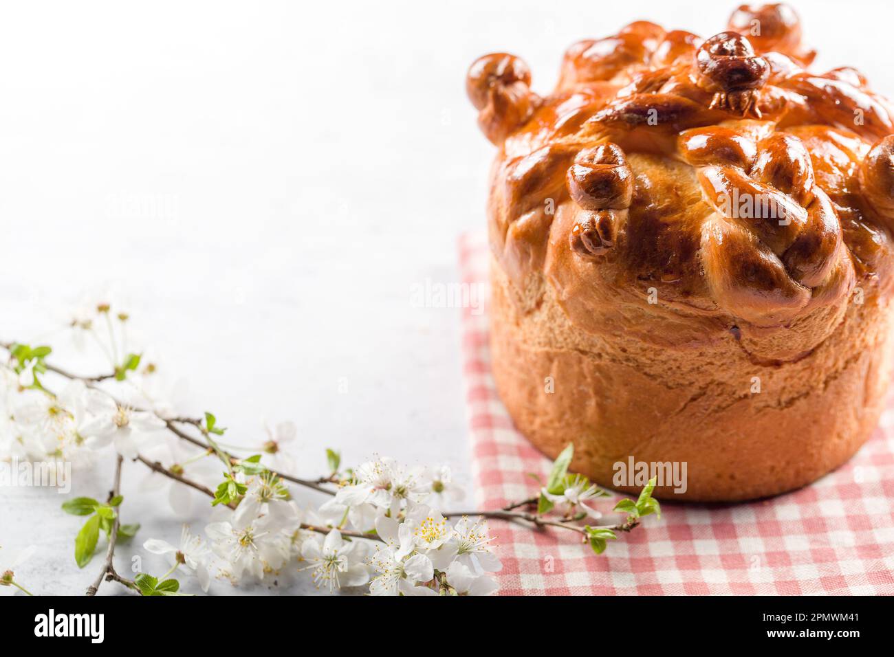Homemade Easter cake with willow branches on a white background Stock Photo