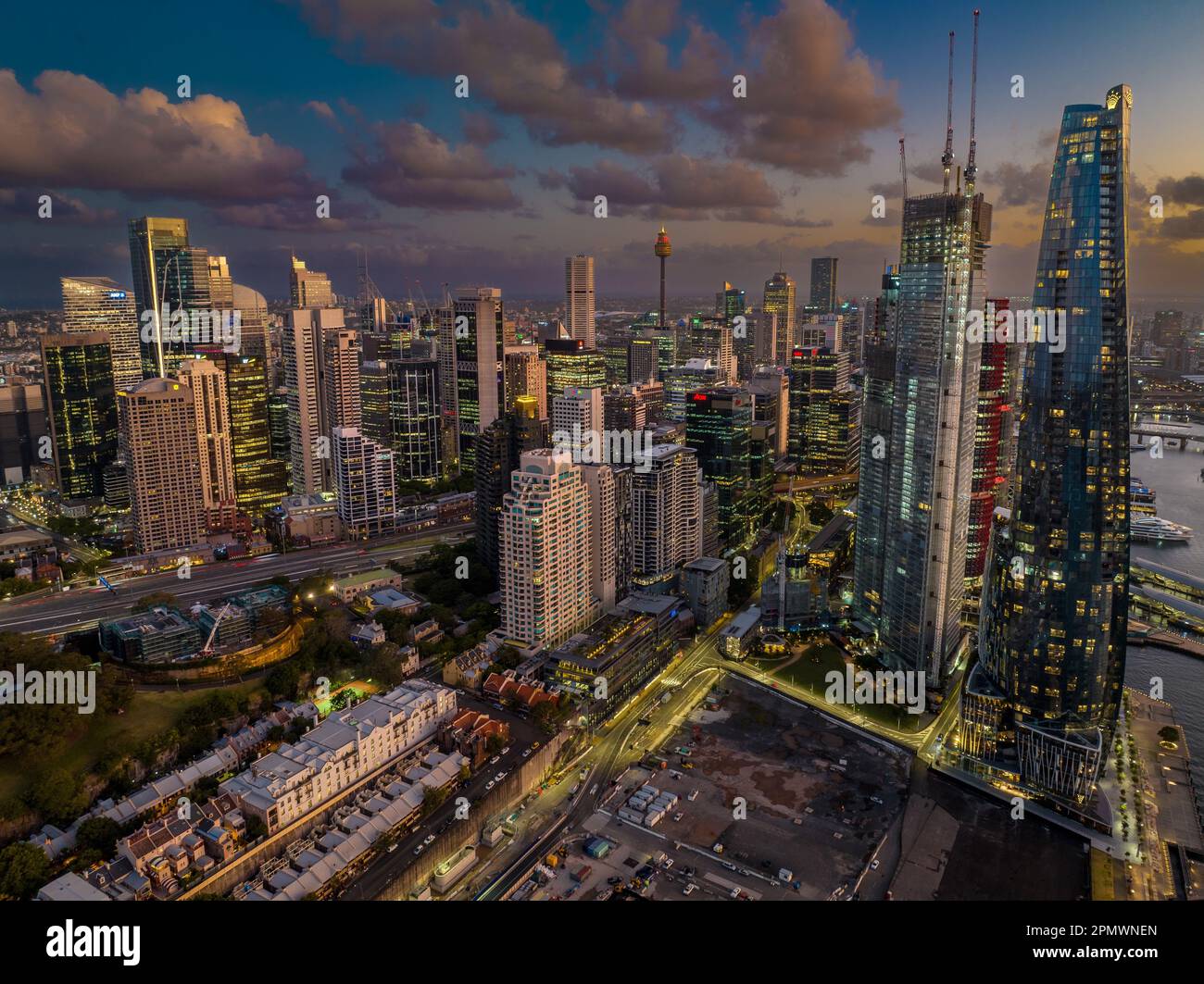 A stunning view of the city skyline illuminated in the night sky, with ...