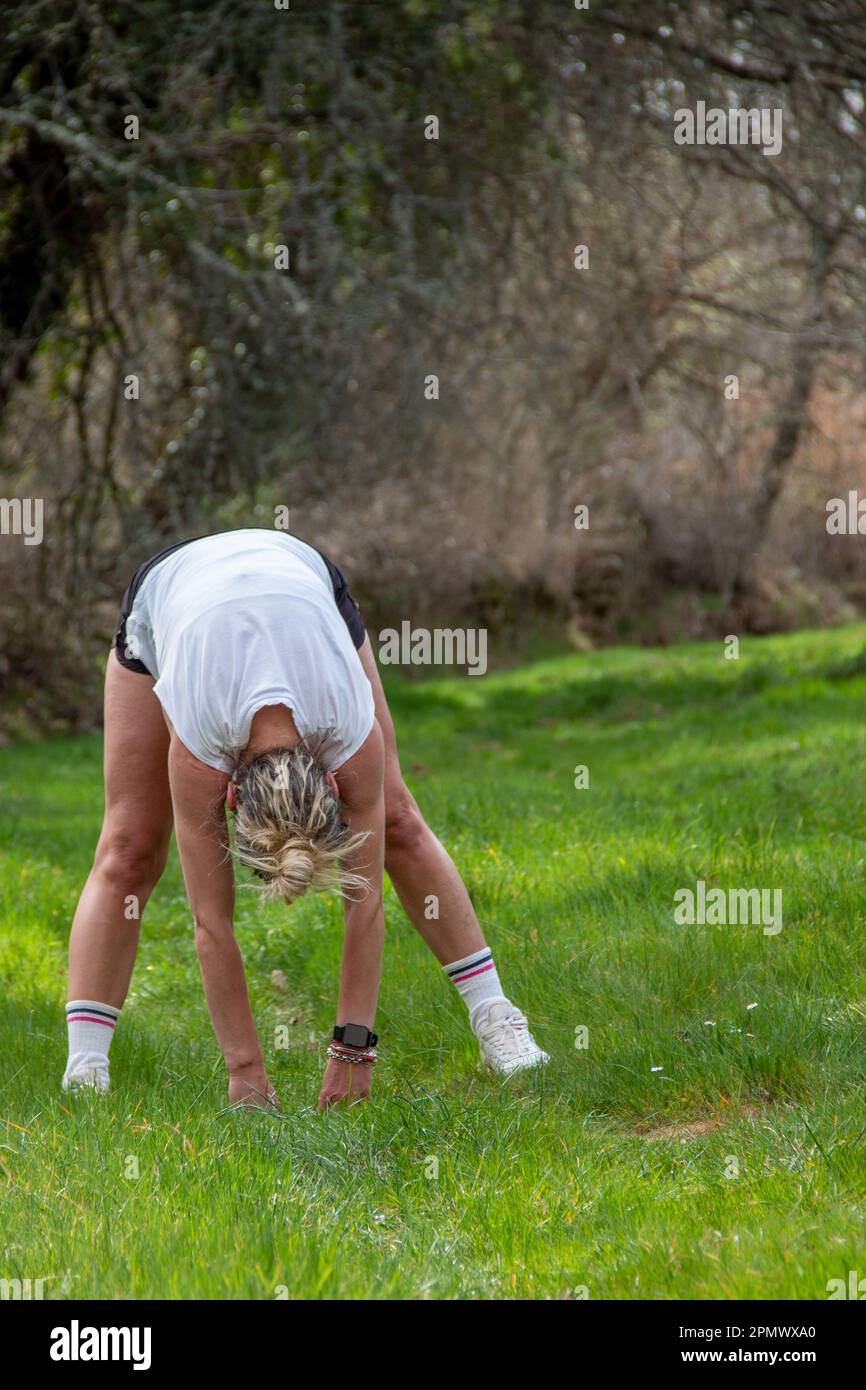 Person stretching grass hi-res stock photography and images - Alamy