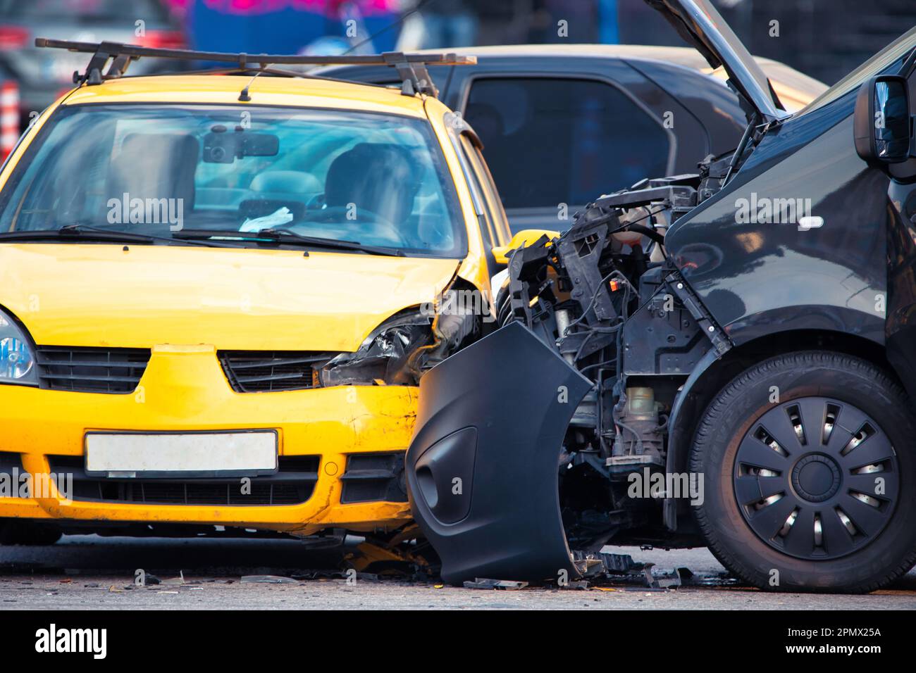 This photo captures the aftermath of a car accident between a blue and