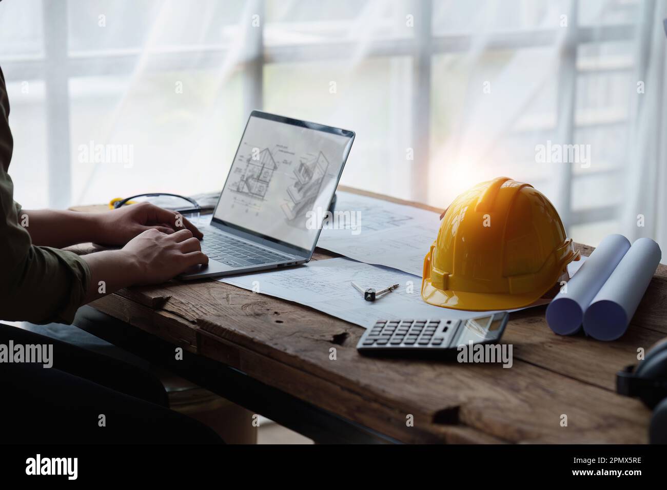 Architect and Engineer working with blueprints for architectural plan ...