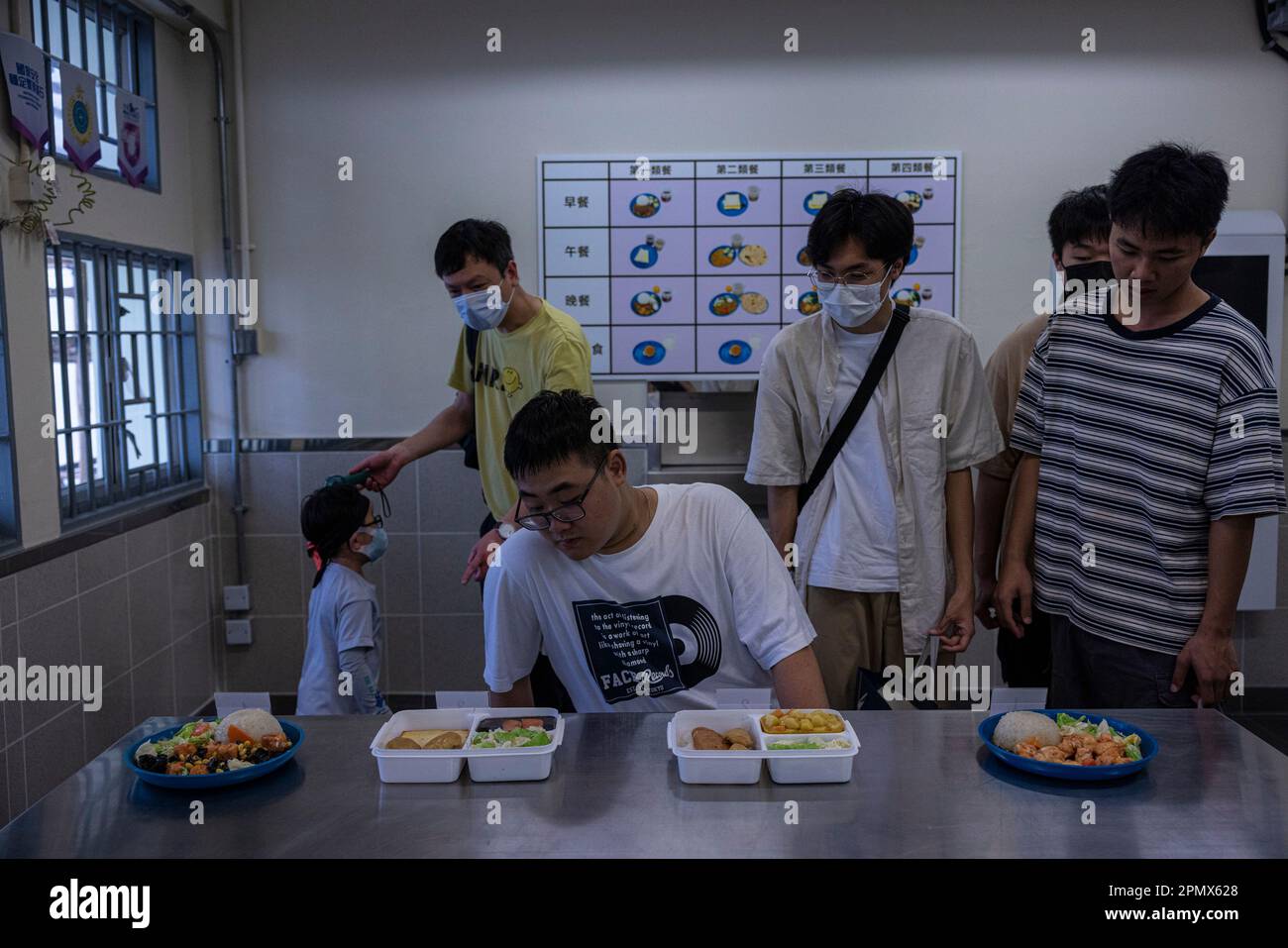People visit a mock prison canteen at the Hong Kong Correctional