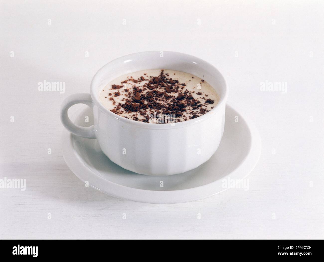 https://c8.alamy.com/comp/2PMX7CH/cappuccino-coffee-with-chocolate-sprinkles-in-white-cup-and-saucer-2PMX7CH.jpg