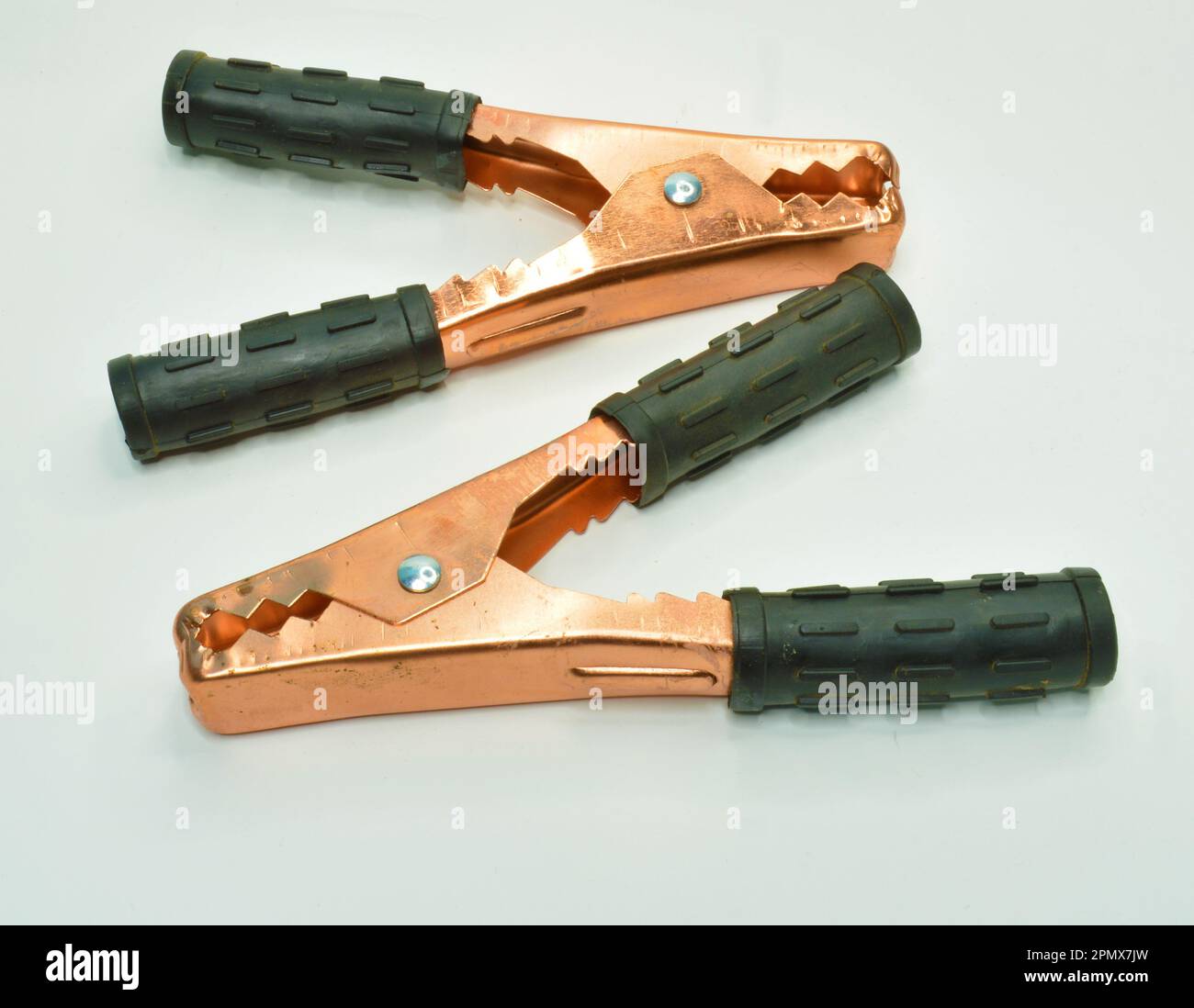 Heavy Duty Battery Jumper Cable Clamps on white background Stock Photo