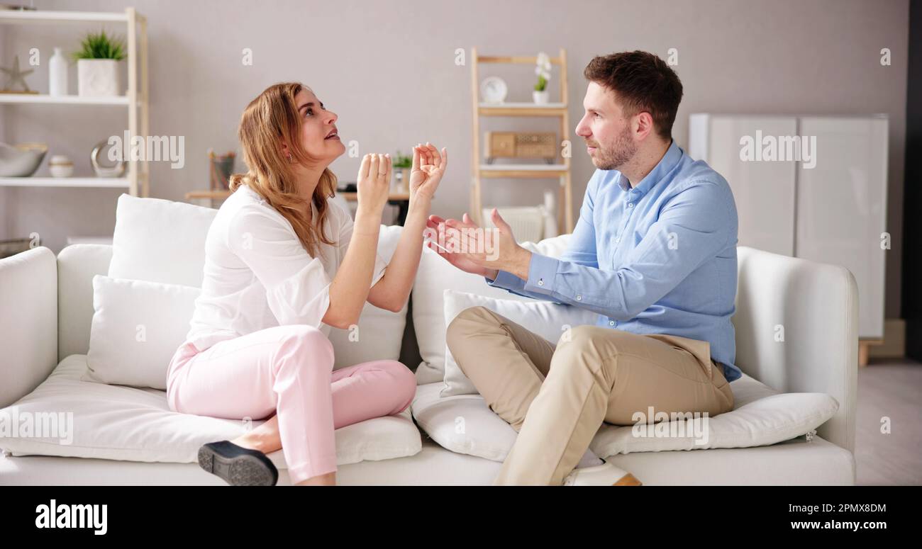 Sad Man Arguing With Woman. Couple Family Divorce Stock Photo