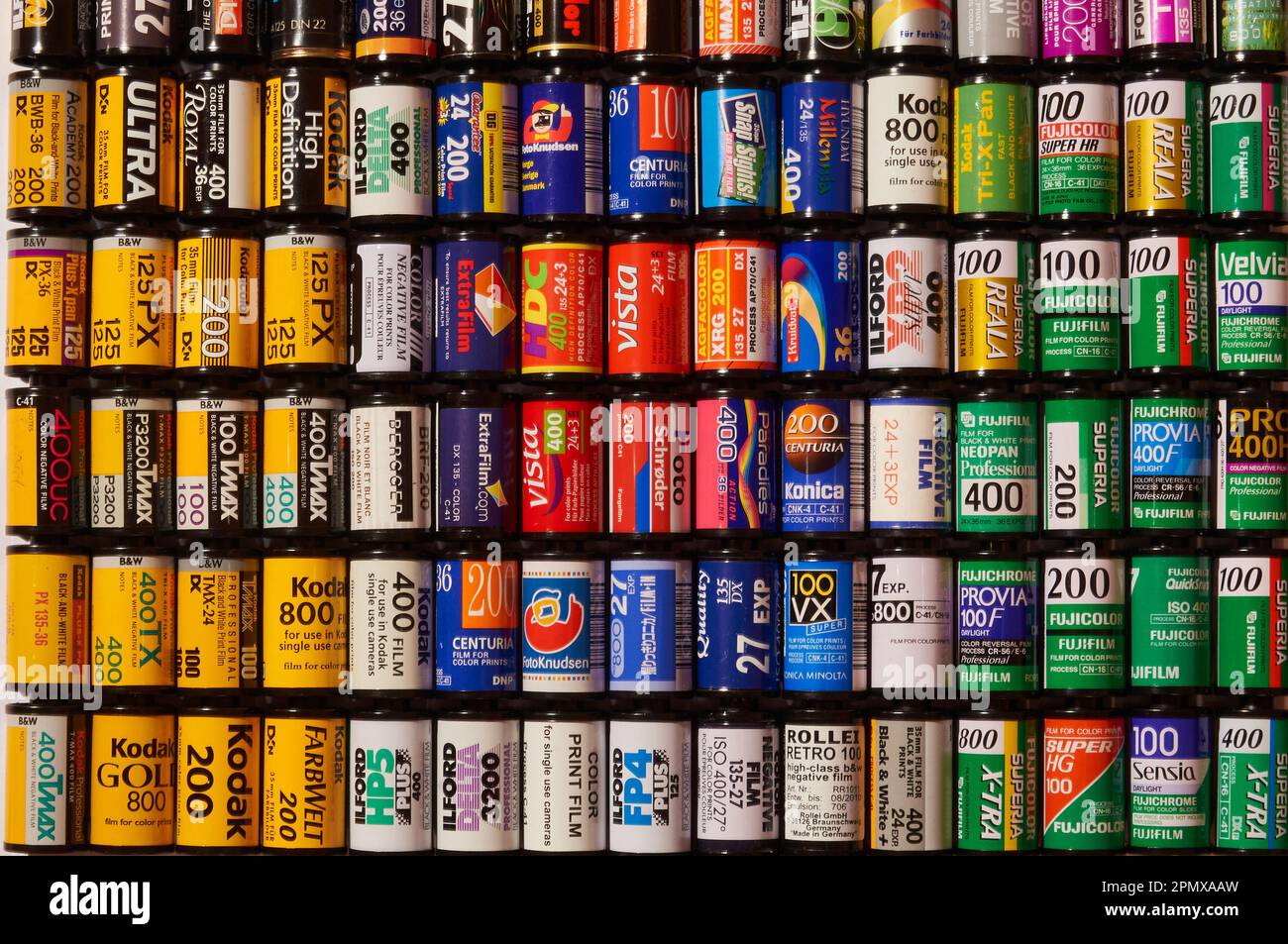 A stack of colorful old school film cartridges Stock Photo