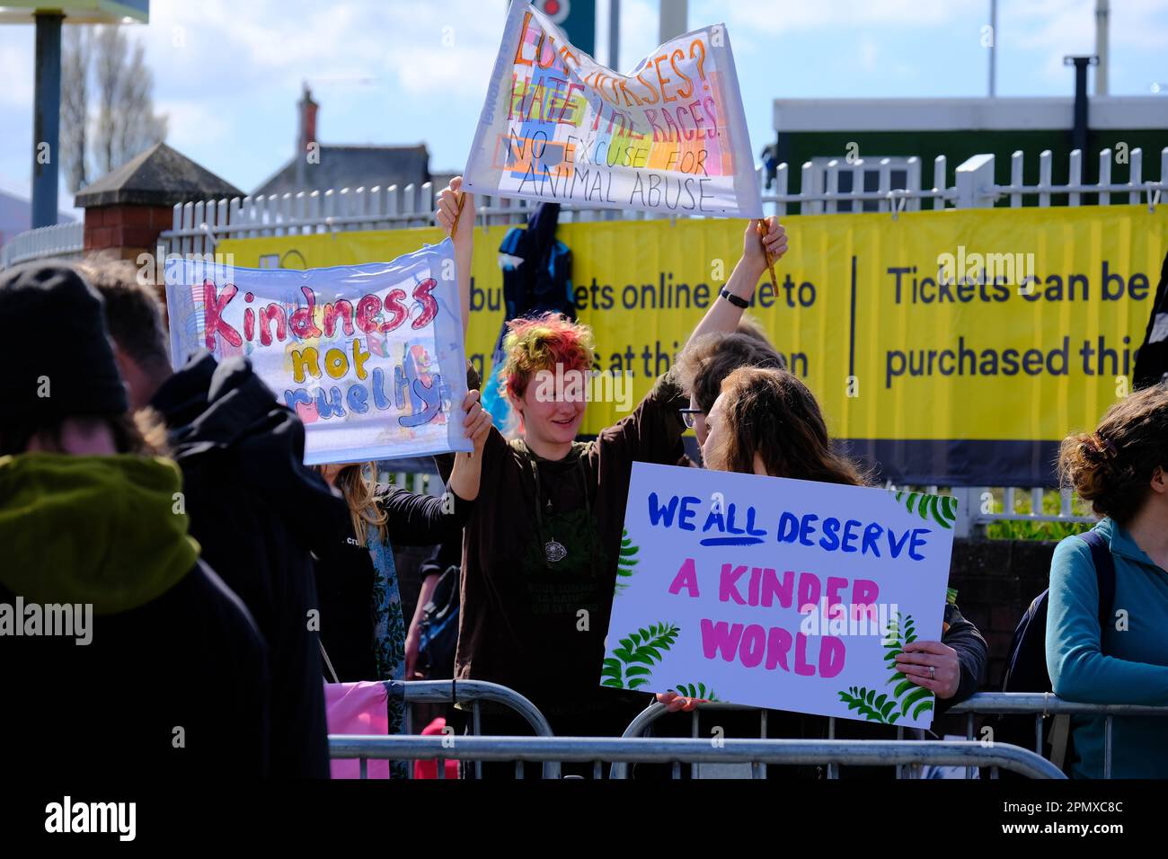 Aintree, Liverpool, UK. 15th Apr 2023. Animal Rising Protesters with placards carry out a peaceful protest outside the racecourse main entrance against the running of The Grand National and with plans to halt the running of the race. Credit: Mark Lear / Alamy Live News Stock Photo