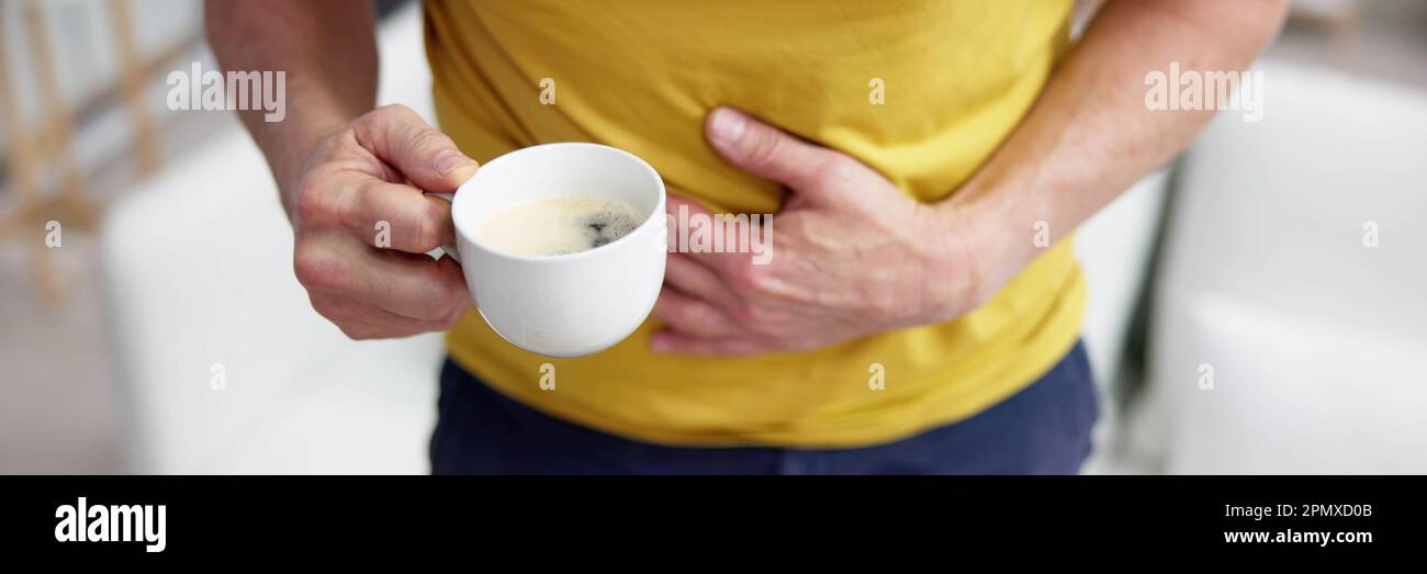 Coffee Stomach Ache. Digesting Acid Pain And Health Risk Stock Photo