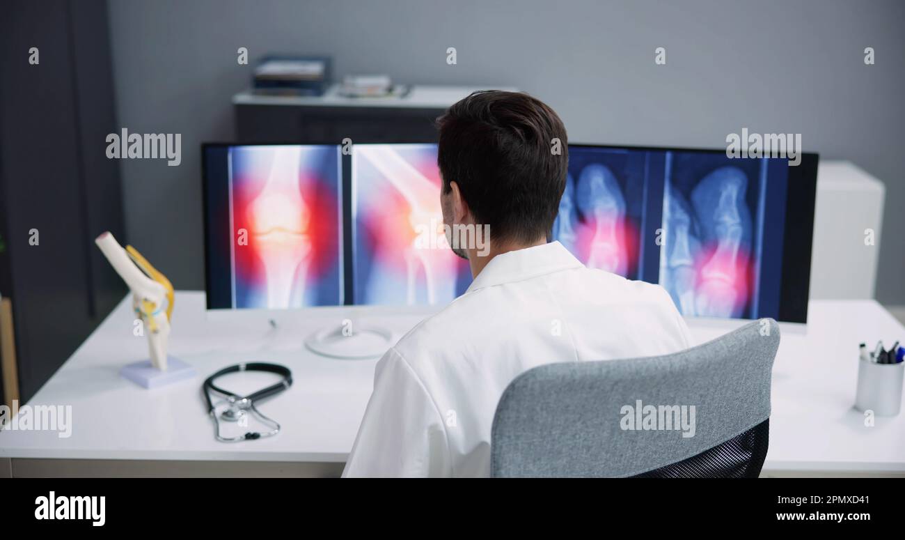 Dentist Using Computer Technology Dental Software For Teeth Xray Stock