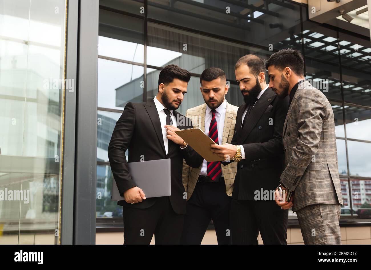Multiethnic men in suits hi-res stock photography and images - Alamy