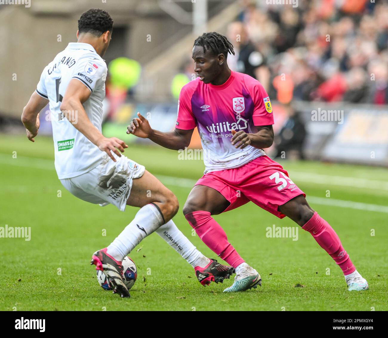 Brahima Diarra #35 of Huddersfield Town and Ben Cabango #5 of Swansea City battles for the ball during the Sky Bet Championship match Swansea City vs Huddersfield Town at Swansea.com Stadium, Swansea, United Kingdom, 15th April 2023 (Photo by Craig Thomas/News Images) in, on 4/15/2023. (Photo by Craig Thomas/News Images/Sipa USA) Credit: Sipa USA/Alamy Live News Stock Photo