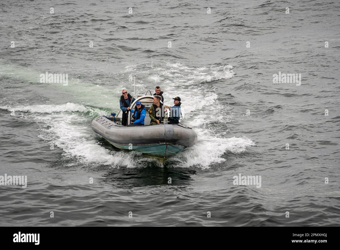 Photographer in an inflatable boat. Stock Photo