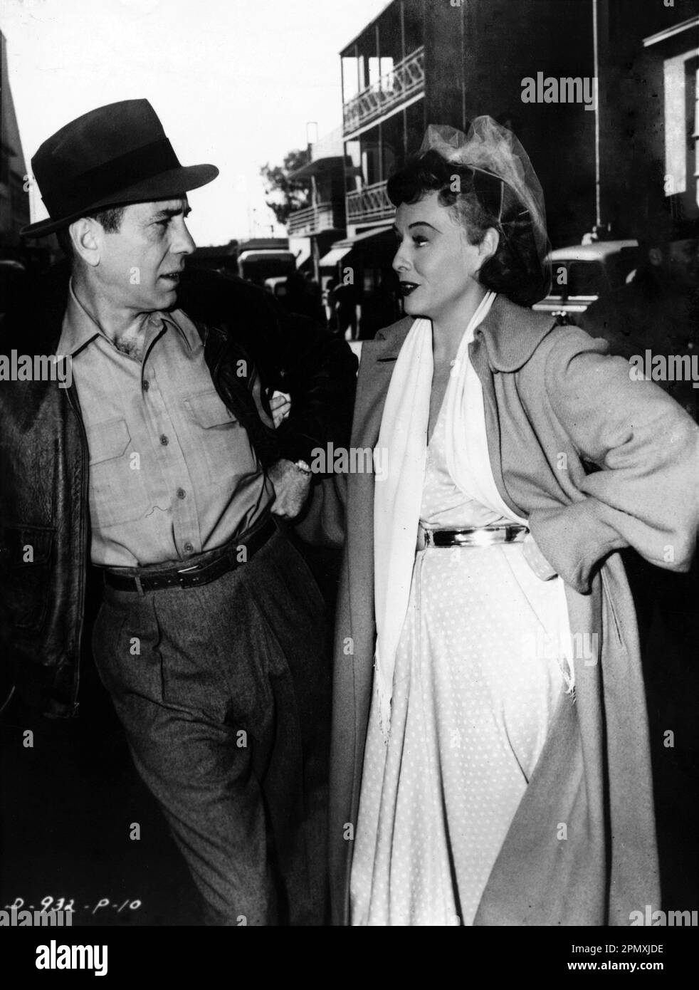 HUMPHREY BOGART (in costume for TOKYO JOE) and PAULETTE GODDARD (in costume for ANNA LUCASTA) in January 1949 on Columbia Studios Lot during break in filming publicity for Columbia Pictures Stock Photo