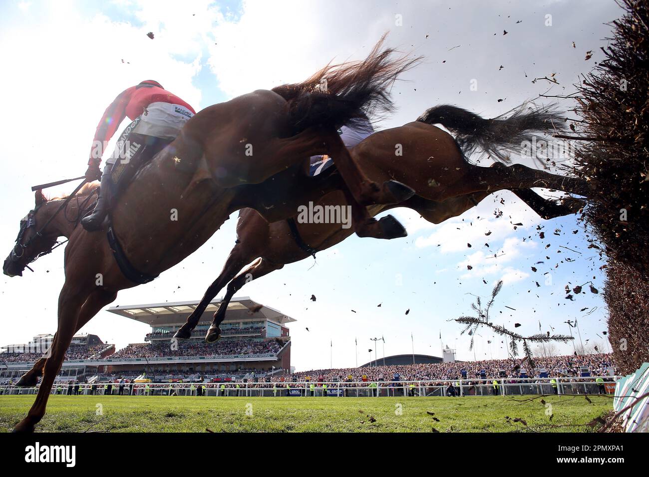 Midnight River ridden by jockey Harry Skelton clear a fence on their way to winning the William Hill Handicap Chase on day three of the Randox Grand National Festival at Aintree Racecourse, Liverpool. Picture date: Saturday April 15, 2023. Stock Photo