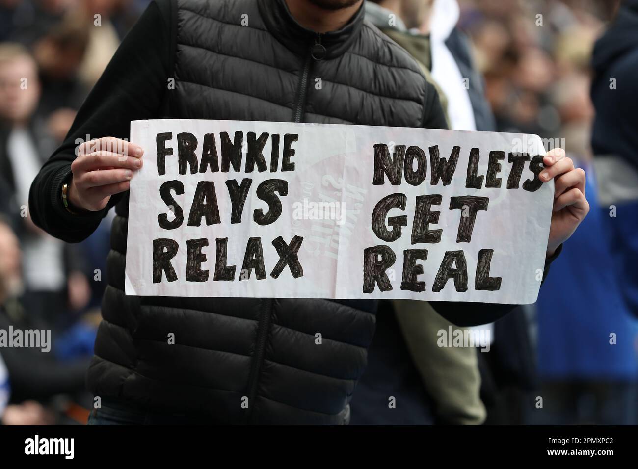 15th April 2023; Stamford Bridge, Chelsea, London, England: Premier League Football, Chelsea versus Brighton and Hove Albion; Chelsea fan holding up a sign saying Frankie Says Relax Now Lets Get Real referencing Chelsea interim manager Frank Lampard Stock Photo
