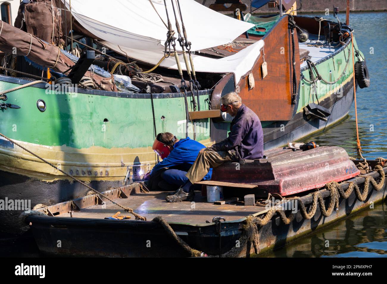 Amsterdam, Netherlands - 6 September 2022: Welder man working on a ship hull Stock Photo