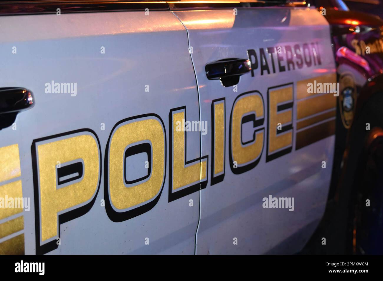 Paterson police vehicle at the crime scene. Four people reported shot
